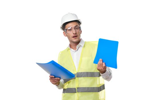 engineer in working uniform protective clothing documents construction. High quality photo