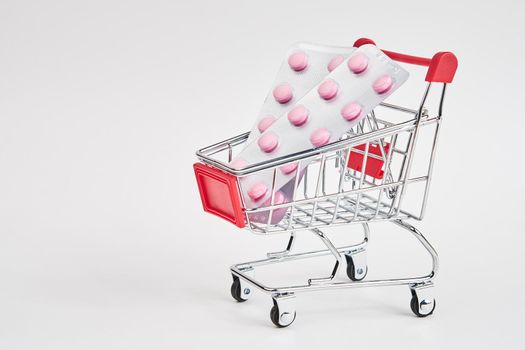 drug trolleys pharmacy shopping light background pharmacy. High quality photo