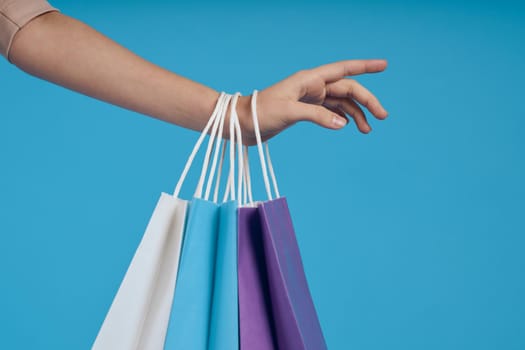 cheerful woman with packages in hands Shopaholic isolated background. High quality photo