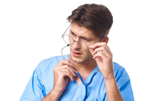 male doctor wearing glasses stethoscope posing light background. High quality photo