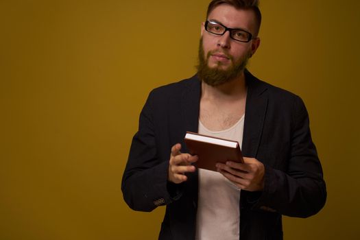 business man with glasses notepad in the hands of a studio official. High quality photo