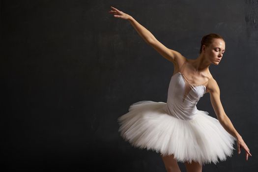 ballerina dance performance classic dark background tradition. High quality photo