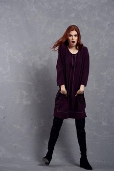 woman with red hair posing fashionable clothing elegant style. High quality photo