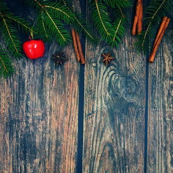 Christmas background with decorations on a brown wooden background. Flat lay, top view with copy space.