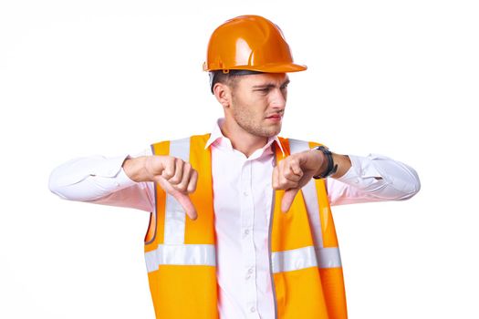 working man in orange uniform posing construction. High quality photo