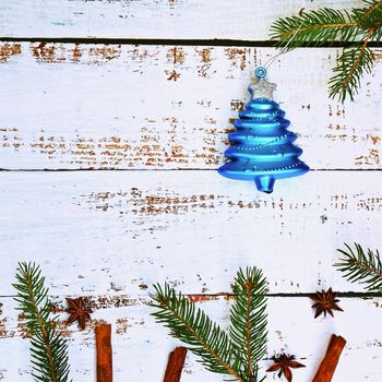 Christmas background. Beautiful decorations for the Christmas tree on a wooden white background. Concept for holidays and winter time with copy space.