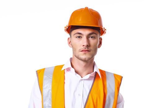 engineer in orange vest posing job professional. High quality photo