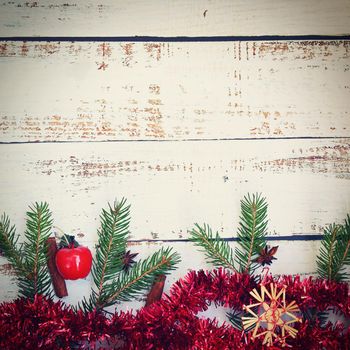 Christmas background. Beautiful decorations for the Christmas tree on a wooden white background. Concept for holidays and winter time with copy space.