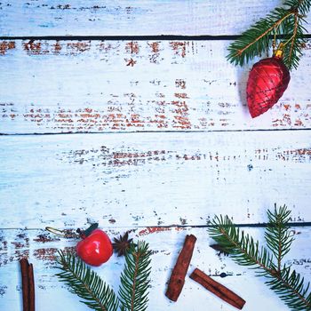 Christmas background. Beautiful decorations for the Christmas tree on a wooden white background. Concept for holidays and winter time with copy space.