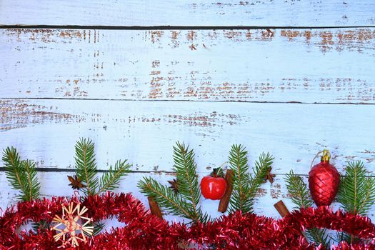 Christmas background. Beautiful decorations for the Christmas tree on a wooden white background. Concept for holidays and winter time with copy space.