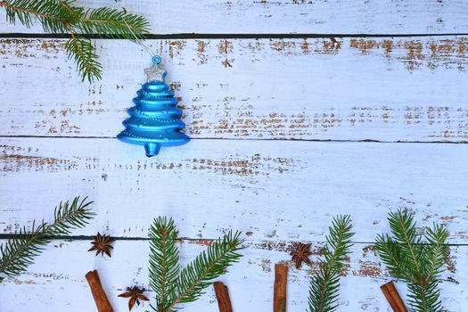 Christmas background. Beautiful decorations for the Christmas tree on a wooden white background. Concept for holidays and winter time with copy space.