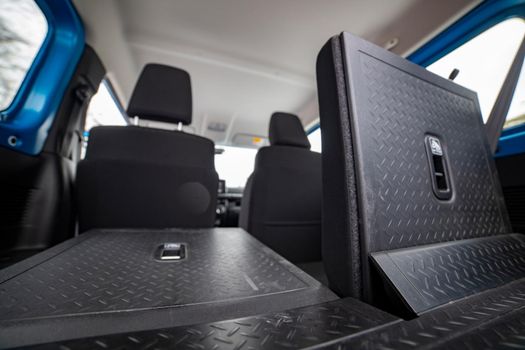 folded rear seats in car, rear view close up. bottom view