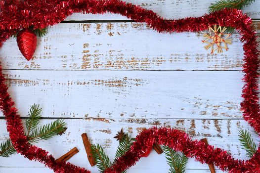 Christmas background. Beautiful decorations for the Christmas tree on a wooden white background. Concept for holidays and winter time with copy space.