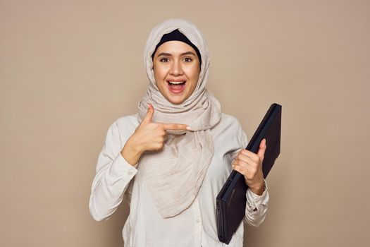 muslim woman with laptop work learning technology. High quality photo