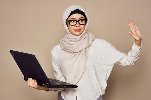 muslim woman with laptop work learning technology. High quality photo