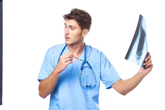 radiologist x-ray diagnostics stethoscope examination work light background. High quality photo