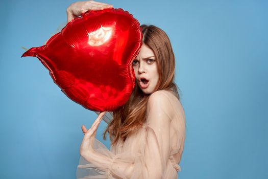 pretty woman heart balloon holiday Valentine's Day blue background. High quality photo