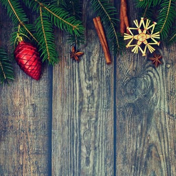 Christmas background with decorations on a brown wooden background. Flat lay, top view with copy space.