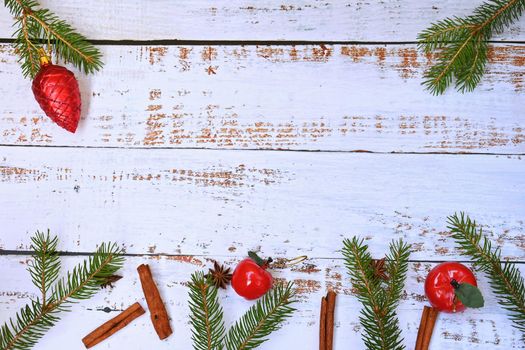Christmas background. Beautiful decorations for the Christmas tree on a wooden white background. Concept for holidays and winter time with copy space.