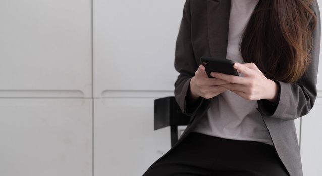 people, communication and technology concept - close up of woman with smartphones at cafe..