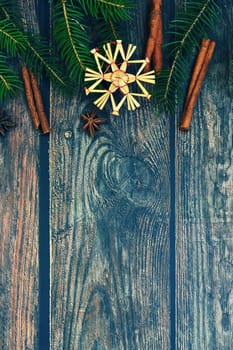Christmas background with decorations on a brown wooden background. Flat lay, top view with copy space.