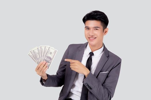 Young asian business man holding money dollar isolated on white background, businessman in suit holding banknote and success and excited with finance, savings and investment, income and spending.