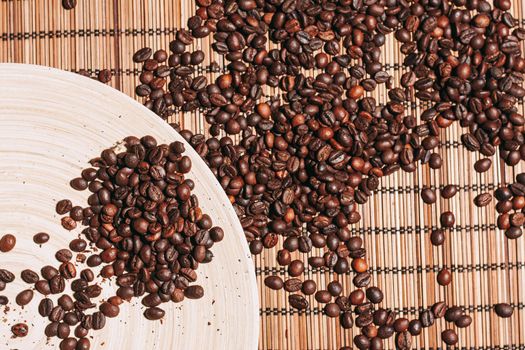 coffee beans Hot drink spilled grains view from above. High quality photo