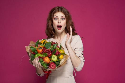 beautiful woman fun posing fruit bouquet vitamins Studio Model. High quality photo