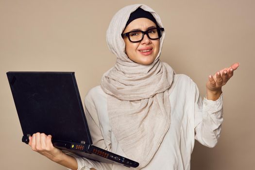 muslim woman with laptop work learning technology. High quality photo