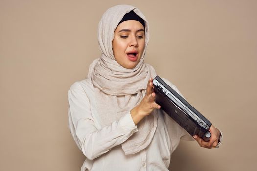 muslim woman with laptop work learning technology. High quality photo