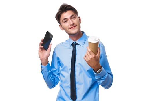man in shirt with tie coffee cup posing office light background. High quality photo