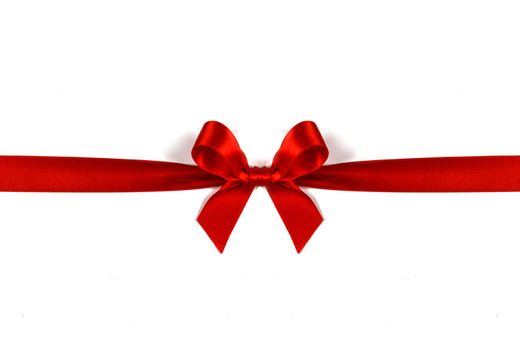Big red satin bow isolated on white background. Christmas holiday gift concept