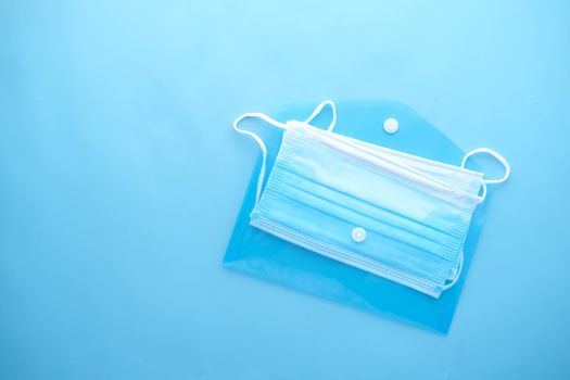 Close up of blue surgical masks on table.