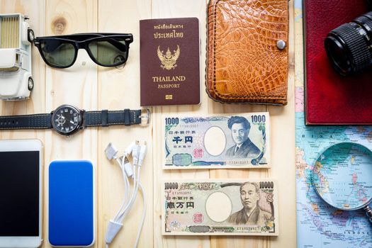 
Top View Of Traveler's Accessories Along For The Trip On Wooden Table, Essential Vacation Items, Travel And Vacations Concept For Background