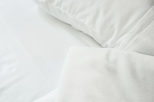 white towel on white mattress fabric, soft light in the morning