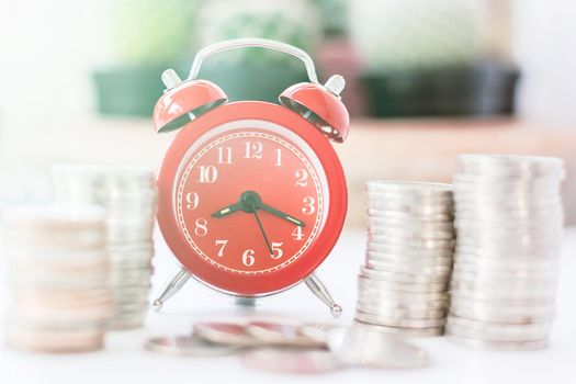 Red old fashioned alarm clock on time to work at make money.