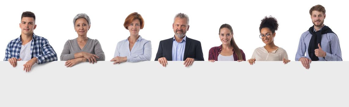 group of cheerful people holding a banner ad isolated on white background