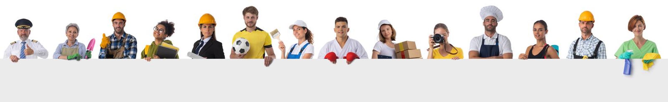 Group of diverse professionals presenting empty banner. Isolated on white background