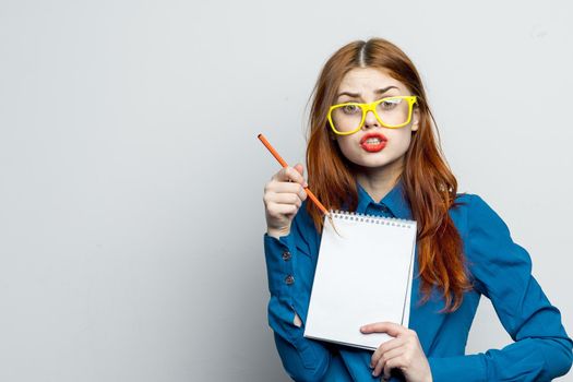 woman secretary with yellow glasses notepad work official. High quality photo