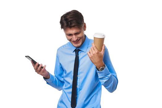 man in shirt with tie communication on the phone a cup of coffee studio lifestyle. High quality photo