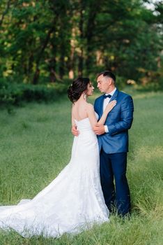 A couple in love a guy and a girl on a walk in the forest belt