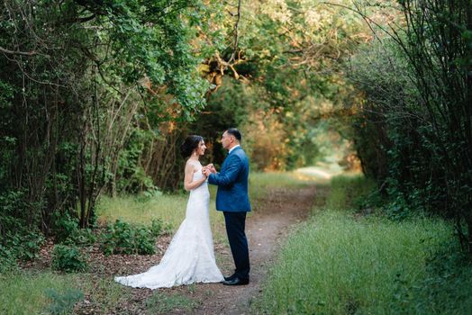 A couple in love a guy and a girl on a walk in the forest belt