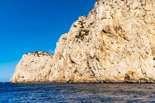 Edge of high cliff next to the sea at sunny day on Capri island