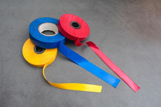 Three rolls of electrical tape for repair and bonding of wires and other types of work
