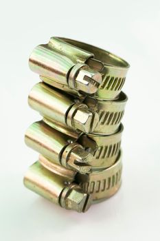 Stainless steel metal clamps on a white background.