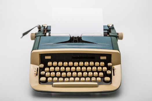 Old typewriter on white background