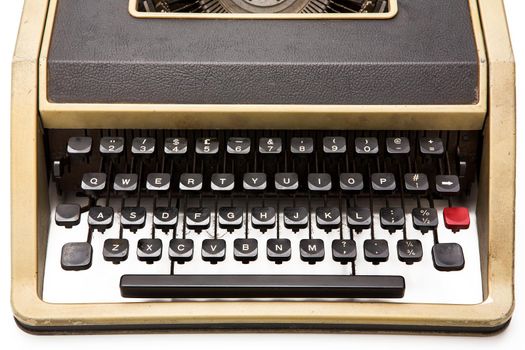 Old typewriter on white background