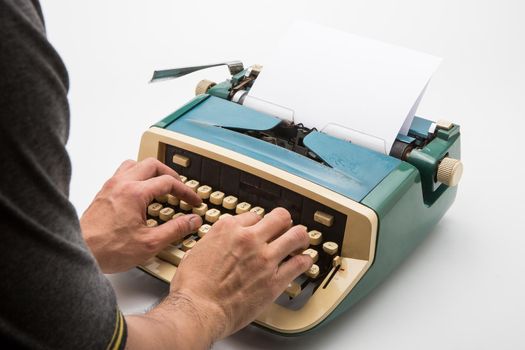 Old typewriter on white background