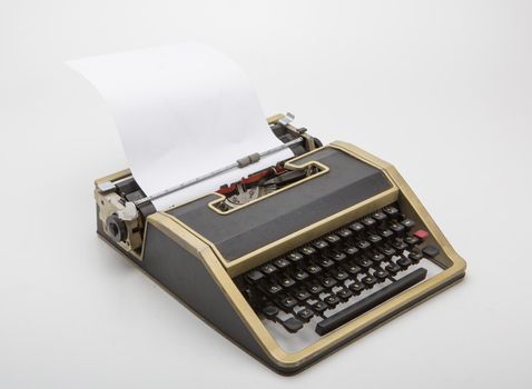 Old typewriter on white background