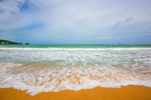 Coastal sea waves with blue sky